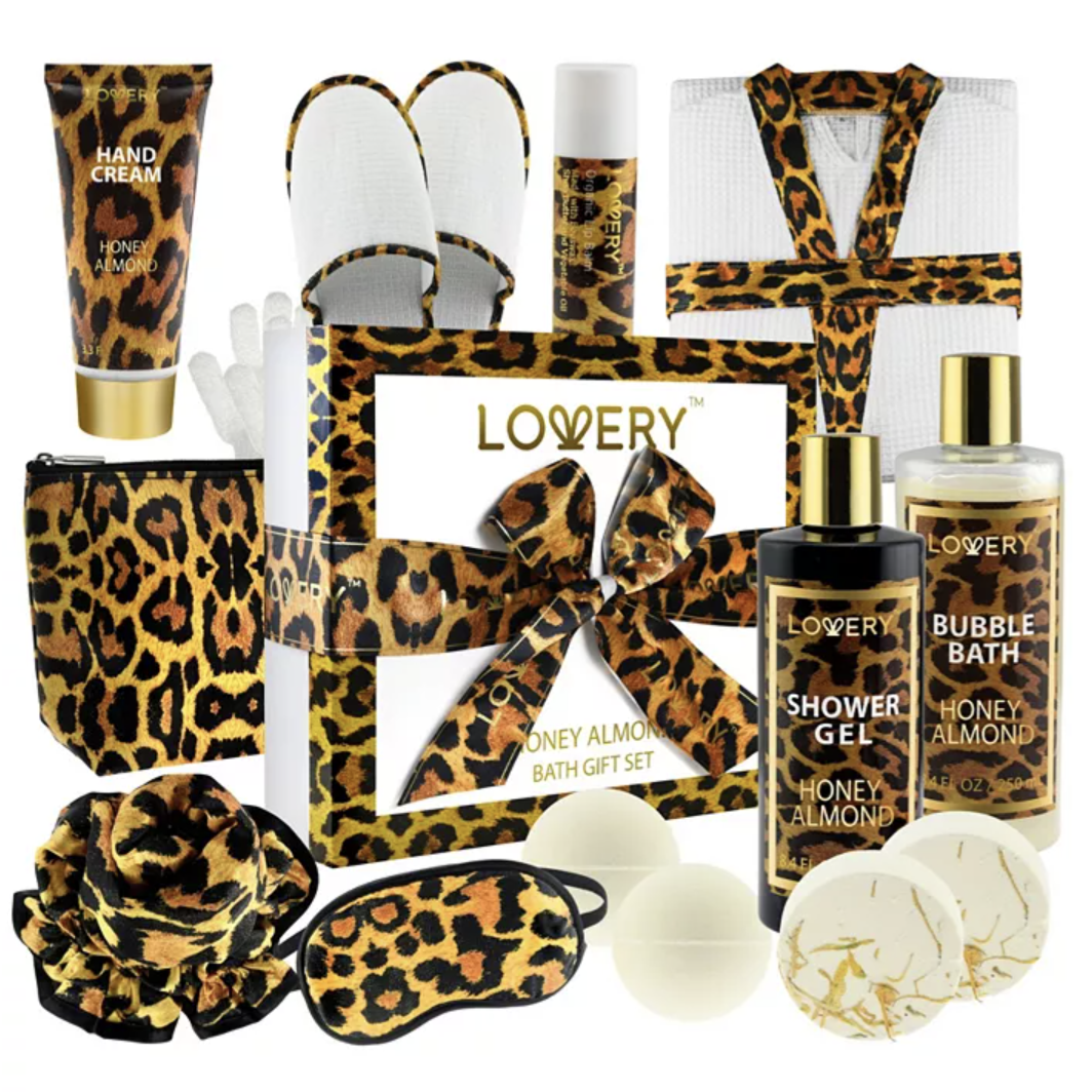 Leopard-print honey almond bath gift set includes hand cream, shower gel, bubble bath, lip balm, bath bombs, soap, eye mask, slippers, cosmetic bag, shower puff, gloves, and a robe with matching accents.