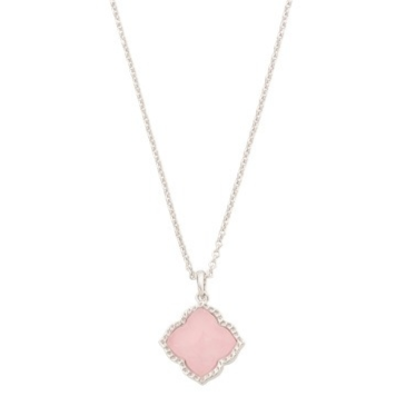 A necklace with a thin chain featuring a pink clover-shaped pendant bordered by a silver or diamond-like edge.