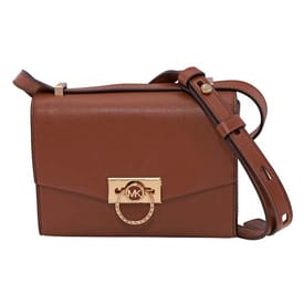 A brown Michael Kors leather crossbody bag with a gold MK logo on the front flap and an adjustable strap.
