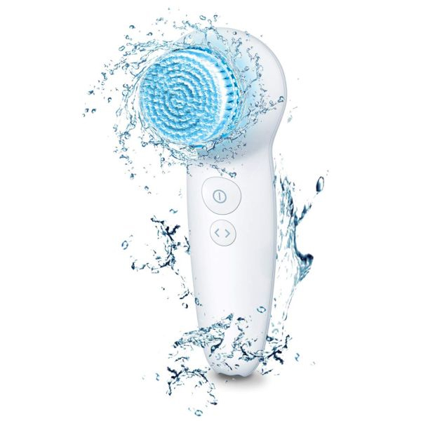 A handheld LED facial brush with a circular bristle head illuminated in blue, featuring two buttons for power and settings, and designed for water resistance, as shown by the surrounding water splashes.
