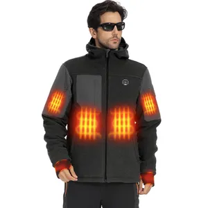 A man wearing a heated jacket with visible orange heating elements on the chest, arms, and wrists. He is also wearing sunglasses.