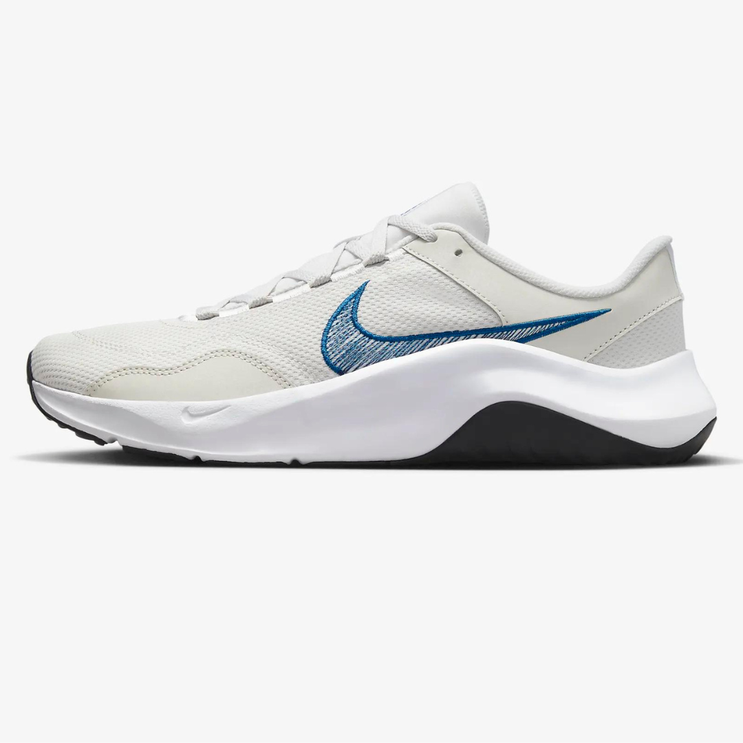White and black athletic shoe with a blue swoosh logo.