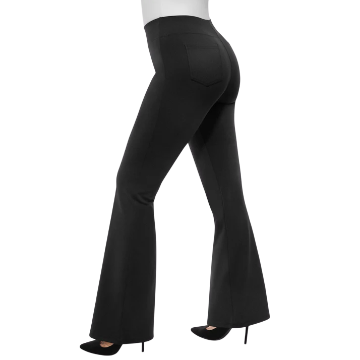 Black high-waisted, flared pants paired with black stiletto heels, viewed from the back left side showing a pocket detail.