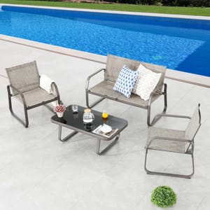 Outdoor furniture set featuring two single chairs, a loveseat with patterned pillows, and a rectangular coffee table placed alongside a swimming pool.