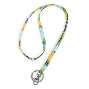A colorful fabric lanyard with a tropical fruit design on a light blue background, featuring a silver-tone key ring and lobster clasp for holding keys or ID badges.