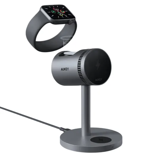 AUKEY wireless charging stand designed for Apple Watch, featuring a sleek metallic design with a magnetic charging area, connected by a USB cable.