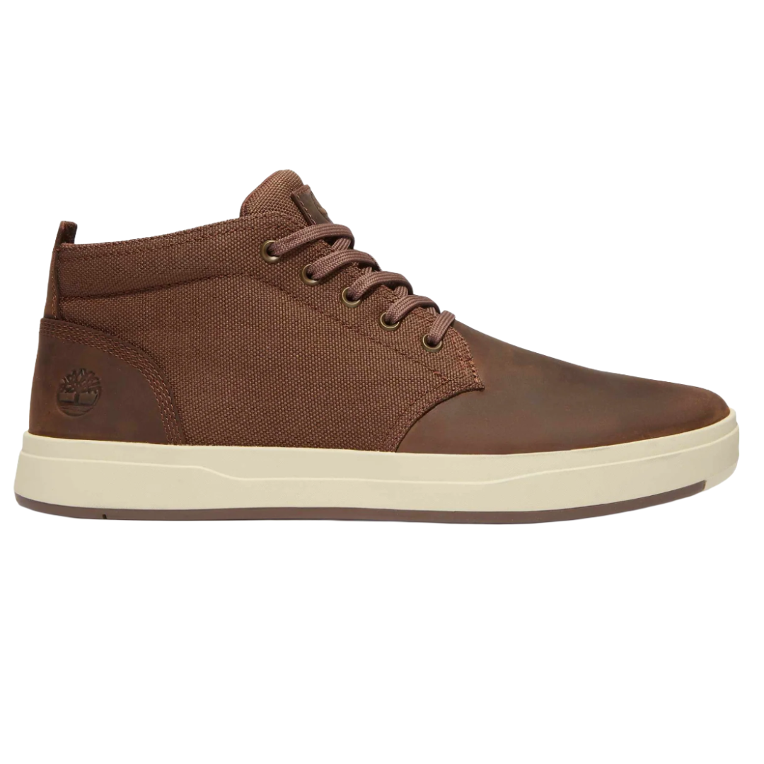 Brown mid-top sneaker with a textured fabric and leather design, featuring white rubber soles and brown laces.