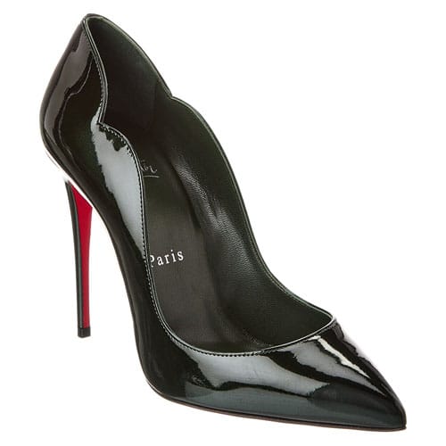 A sleek black patent leather stiletto pump with a pointed toe, featuring a high heel and a signature red sole.