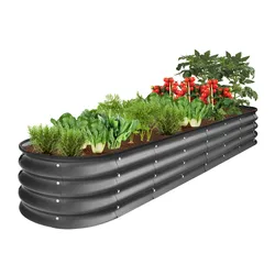 A raised garden bed made of corrugated metal filled with various vegetables and herbs.