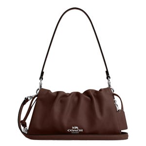 Brown Coach leather shoulder bag with a drawstring closure, silver-tone hardware, and a detachable strap for versatile carrying options.