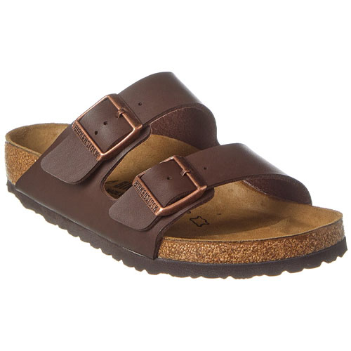 Brown leather sandal with two adjustable straps and a contoured cork footbed featuring metal buckles.