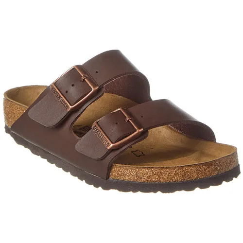 Brown leather sandal with two adjustable straps and a contoured cork footbed featuring metal buckles.