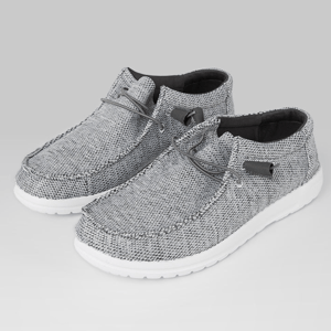 A pair of grey textile shoes with laces and white soles.