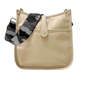Beige shoulder bag with a camouflage pattern strap.