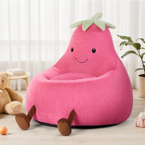 Pink plush chair shaped like a smiling eggplant with leaf top, featuring small brown legs, placed in a cozy room setting with a teddy bear, books, and a plant nearby.