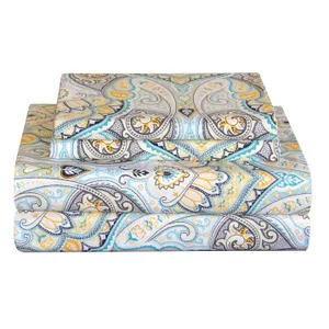 A set of bed sheets with an intricate paisley pattern in teal, yellow, and gray tones.