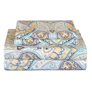 A set of bed sheets with an intricate paisley pattern in teal, yellow, and gray tones.