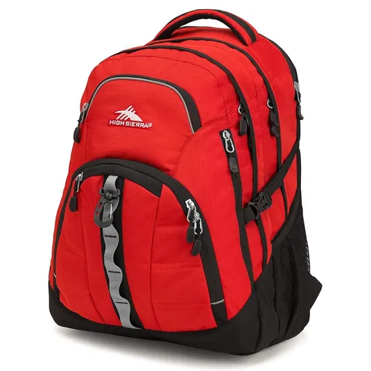 A red and black High Sierra backpack with multiple zippered compartments, side mesh pockets, and a padded top handle, ideal for school or travel use.