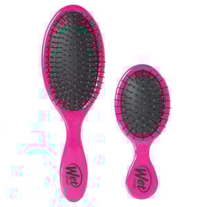 Two pink hairbrushes with black bristles. The larger brush has a full-size handle, while the smaller is a travel-friendly version. Both feature the \“Wet Brush\“ logo on the handles.