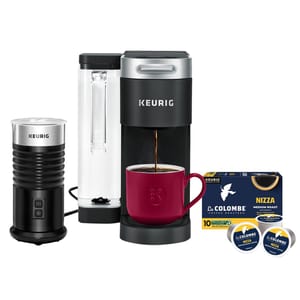 Keurig coffee maker set featuring a single-serve brewer, milk frother, La Colombe Nizza medium roast coffee pods, and a red mug.