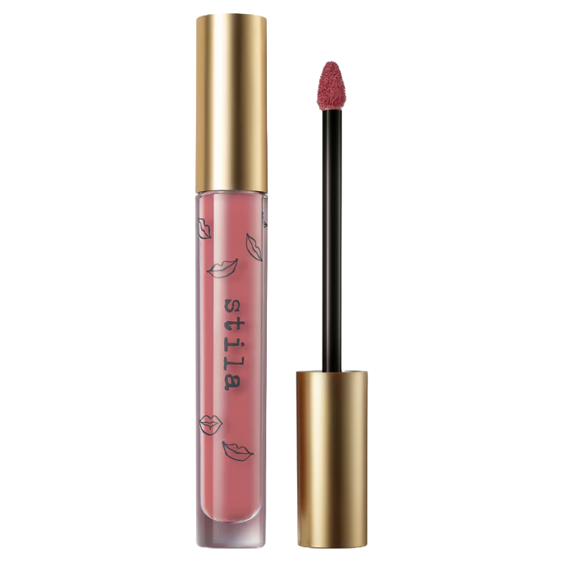 A tube of Stila liquid lipstick with a golden cap and applicator wand, featuring a pink shade with lip prints on the packaging.