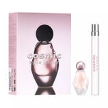 Cosmic by Kylie Jenner features a perfume set with a bottle and a travel-sized spray. The packaging is light pink with bold branding.