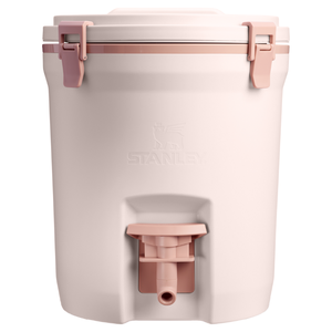 A Stanley water cooler with a spout, featuring a light pink color and pink latch details.