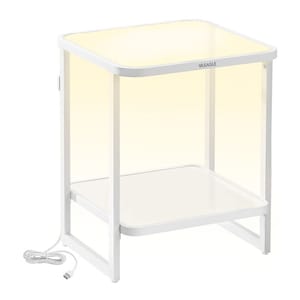 A white end table with a glass top and a lower shelf, featuring integrated LED lighting and a power cord for illumination.