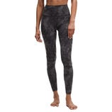 High-waisted, full-length leggings with a dark camouflage pattern, designed for a snug and comfortable fit.