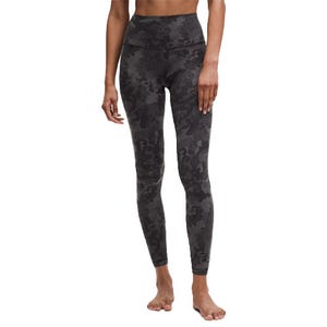 High-waisted, full-length leggings with a dark camouflage pattern, designed for a snug and comfortable fit.