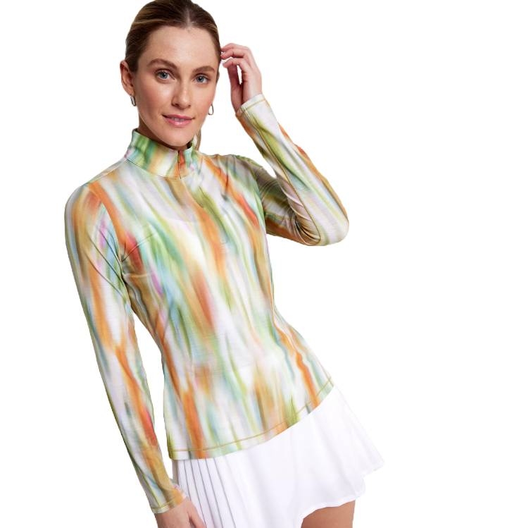 A woman wearing a long-sleeve, multicolored, striped top with a mock neck and a white pleated skirt. The top features a blend of soft pastel shades.