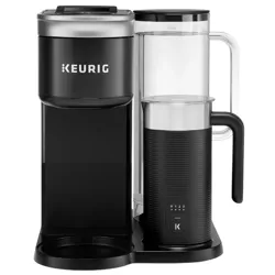 Keurig coffee maker with a built-in frother, featuring a black and silver design and a clear water reservoir.