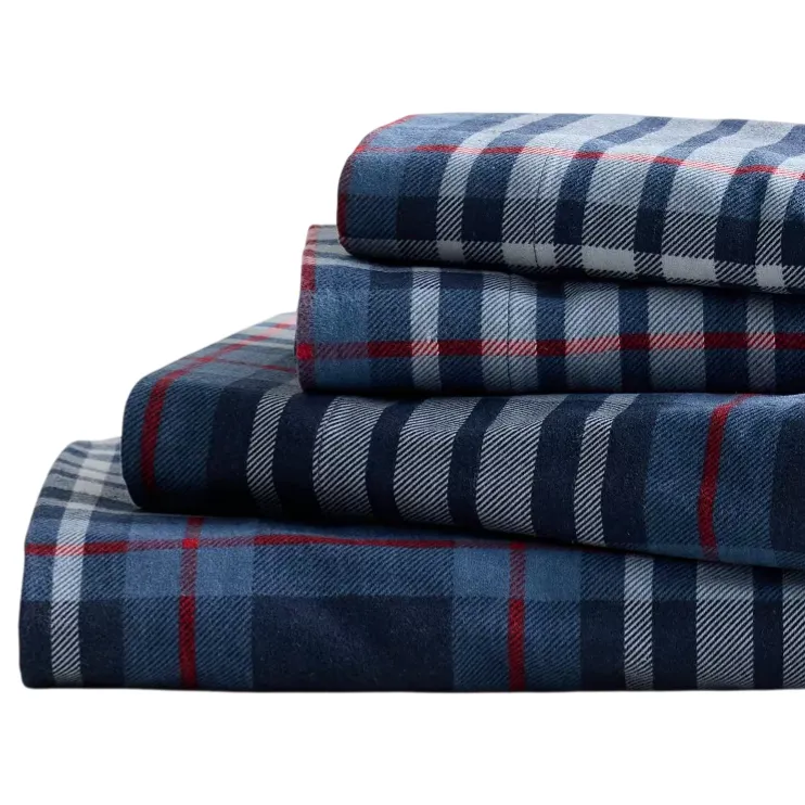 Stack of folded plaid flannel sheets with a blue, red, and white checkered pattern.
