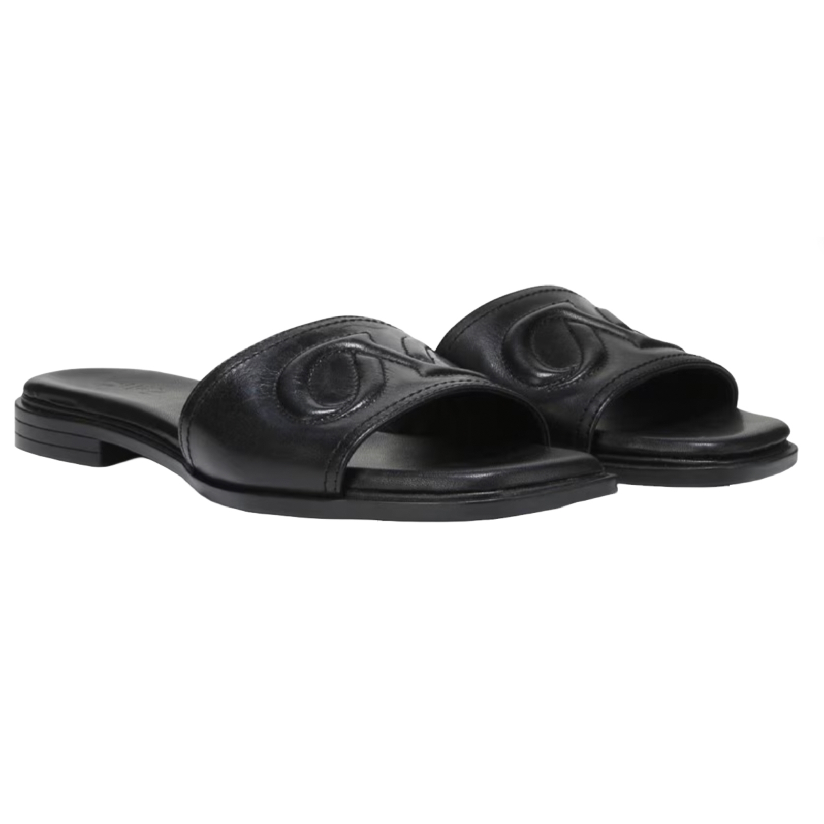 Black leather slide sandals with open toes and a slight heel, featuring an embossed decorative design on the strap.
