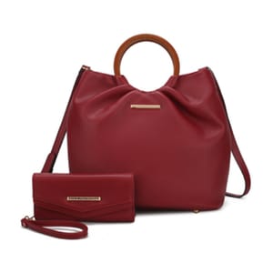 A red handbag with wooden handles and a matching red wallet featuring gold-tone accents and a detachable strap.