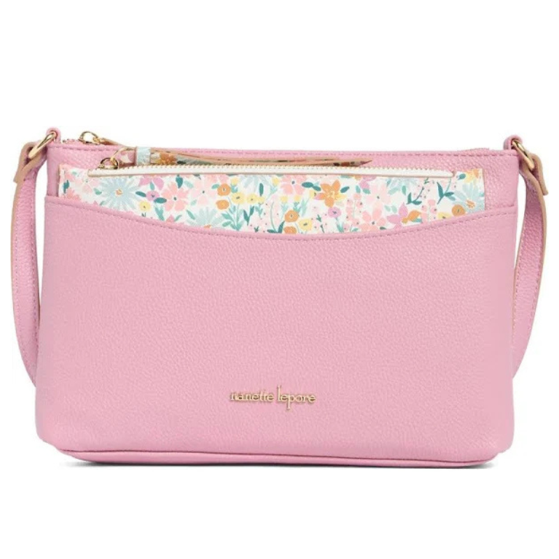 Pink crossbody bag with a textured finish, featuring a floral patterned zippered pocket and gold-tone branding.