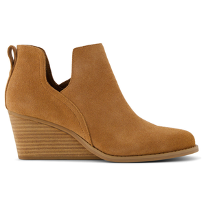 Gwen Ankle Boots are tan, suede-style boots with a low stacked wedge heel and a pull tab at the back for easy wearing. They feature side cutouts for added style.