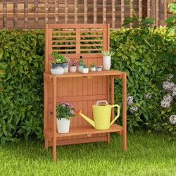 A wooden potting bench with a slatted back is displayed, featuring several potted succulents on the top shelf and a yellow watering can and another plant on the lower shelf, set against a background of lush green foliage.