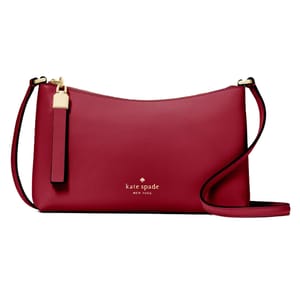 A red Kate Spade New York crossbody bag featuring gold hardware and a long strap.