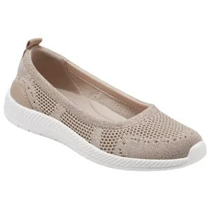 A beige knit slip-on shoe with a white, textured sole designed for casual wear. The shoe features a breathable, stretchable upper and a flat heel, ideal for comfort and everyday use.