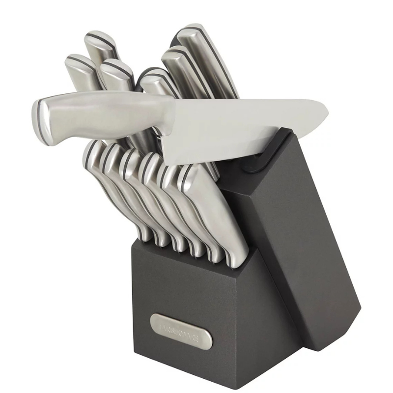 A knife block set with multiple stainless steel knives, including a chef's knife, housed in a black angled stand labeled \“Farberware\“.