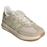 A beige and white Adidas sneaker with a mesh and suede upper, featuring the brand's signature three stripes on the side and a gum sole.