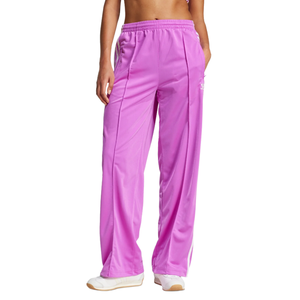 Pink wide-leg track pants with an elastic waistband, featuring white stripes on the sides.