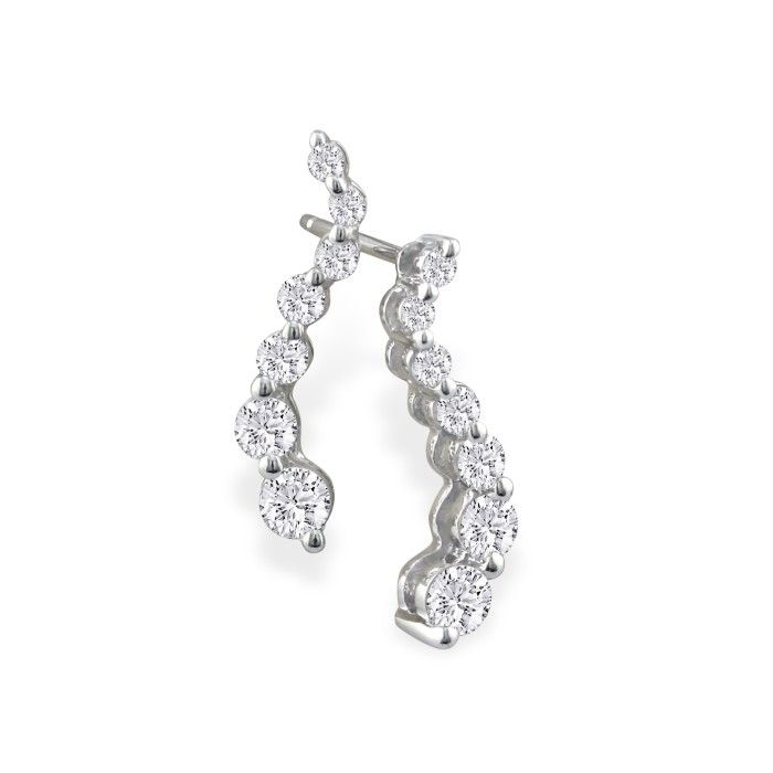 A pair of silver curved earrings featuring a series of round, sparkling stones set in a vertical alignment.