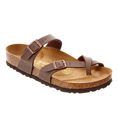 Birkenstock Mayari Sandals feature crisscrossed brown straps with adjustable buckles, a cork footbed for comfort, and a rubber sole for grip.