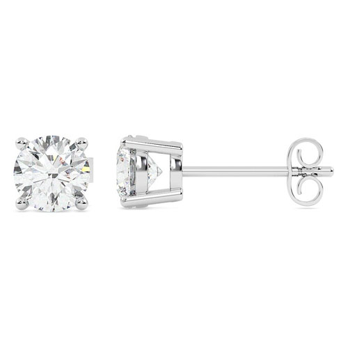 A pair of stud earrings featuring round-cut clear gemstones set in a four-prong metal setting with a straight post and butterfly back closure.