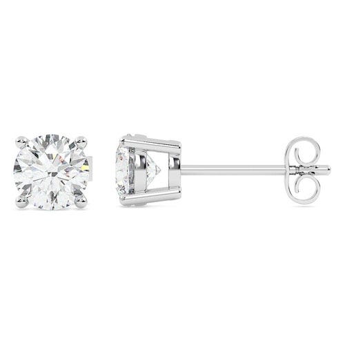 A pair of stud earrings featuring round-cut clear gemstones set in a four-prong metal setting with a straight post and butterfly back closure.