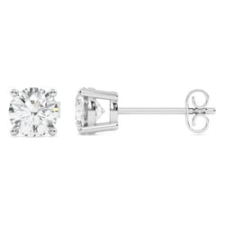 A pair of stud earrings featuring round-cut clear gemstones set in a four-prong metal setting with a straight post and butterfly back closure.