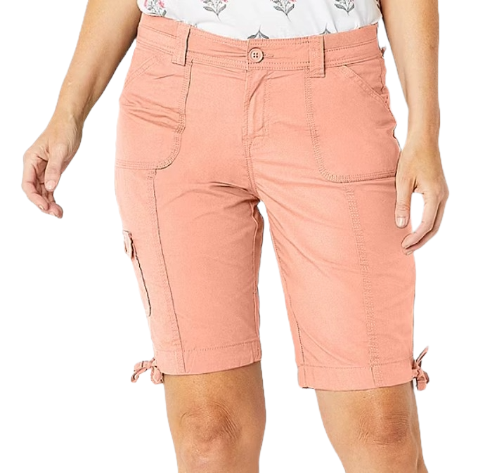 Peach-colored cargo shorts with side pockets, a button closure, and adjustable ties at the hem, paired with a floral patterned top.