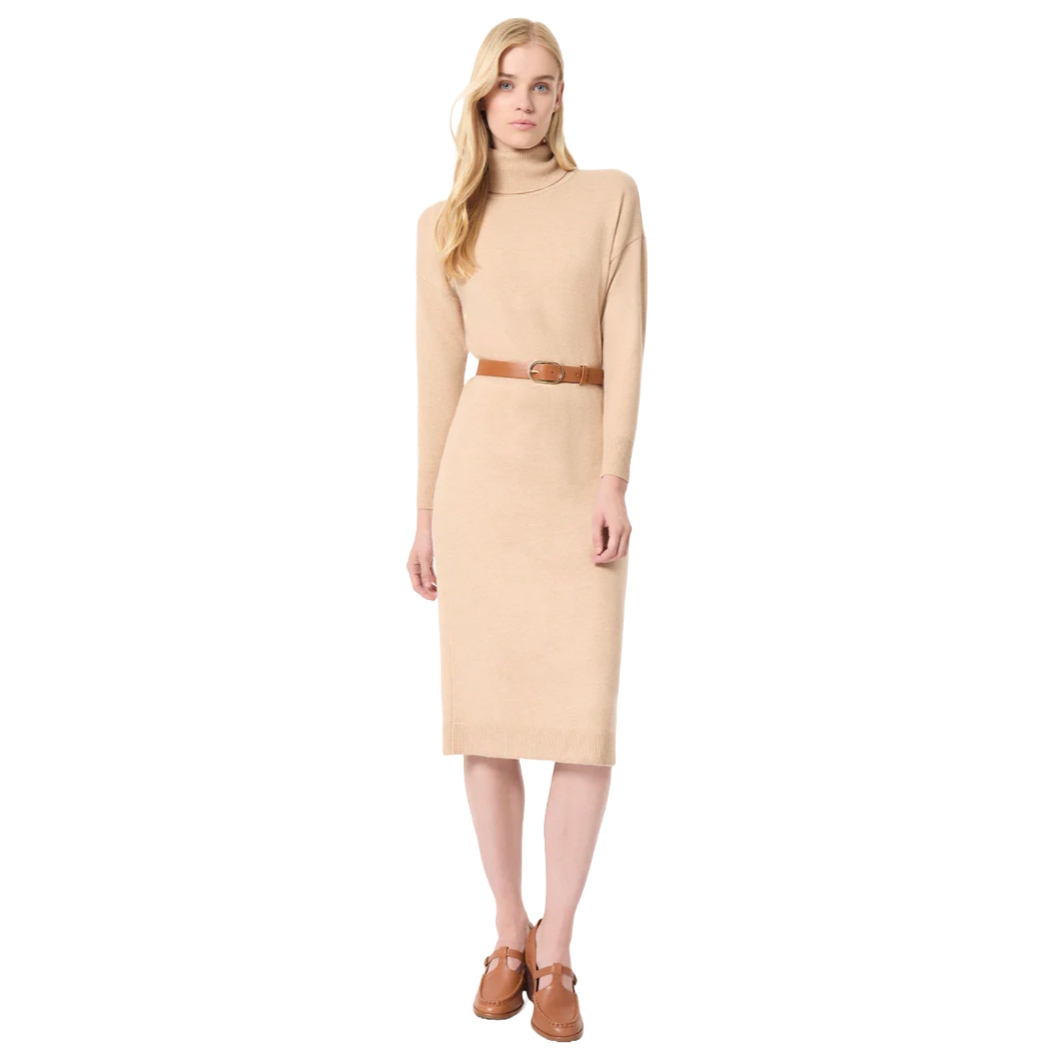 Beige knee-length sweater dress with long sleeves, a turtleneck, and a brown belt at the waist. Paired with tan loafers.